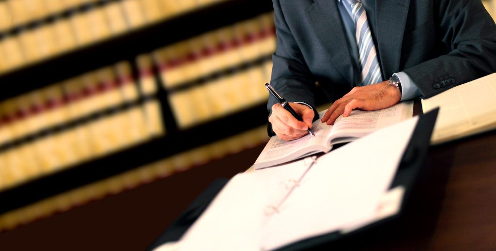 lawyer with books and papers