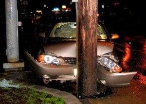 car hits telephone pole