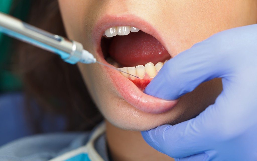 anesthetist injecting gums