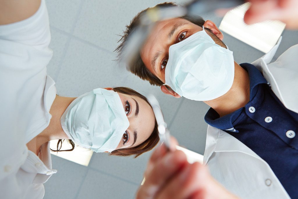dentist working - dental malpractice lawyer