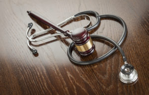 Philadelphia Medical Malpractice Lawyer- wooden gavel with doctors scope